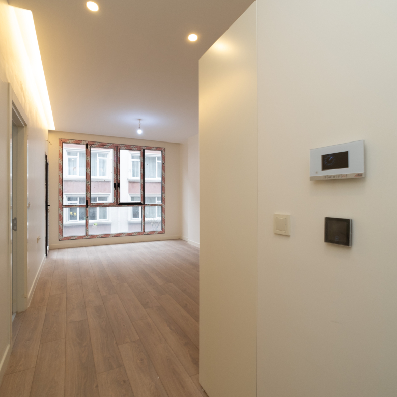 Luxurious bedroom in Taksim Palas with cozy bedding, modern decor, and ample natural light