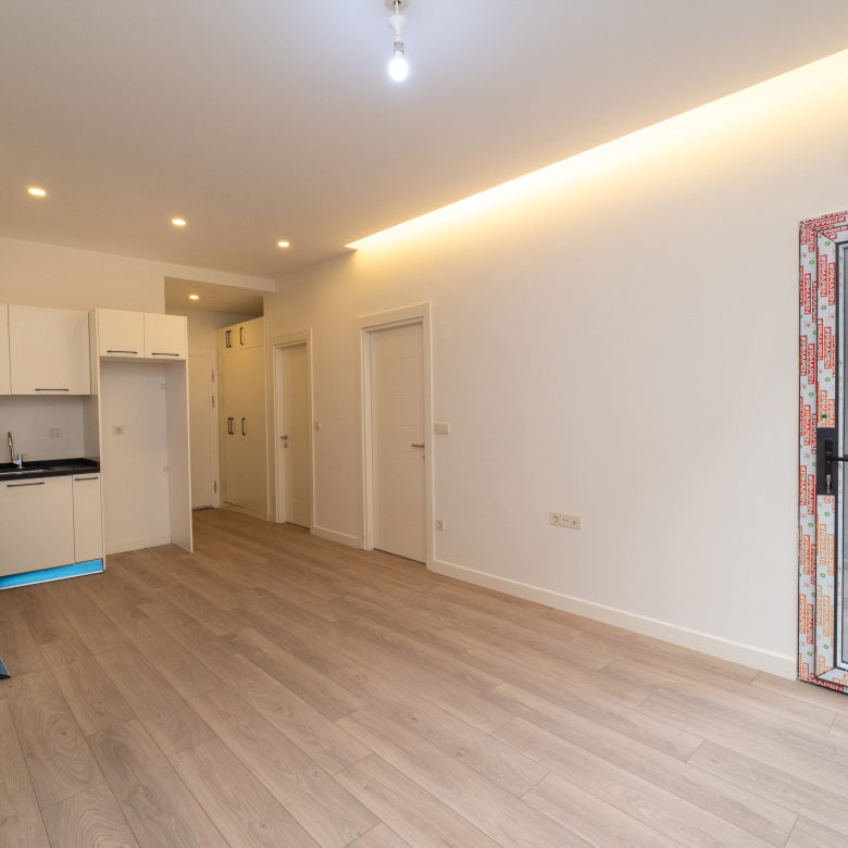 Spacious and bright living room in Taksim Palas, featuring contemporary furniture and large windows with city views