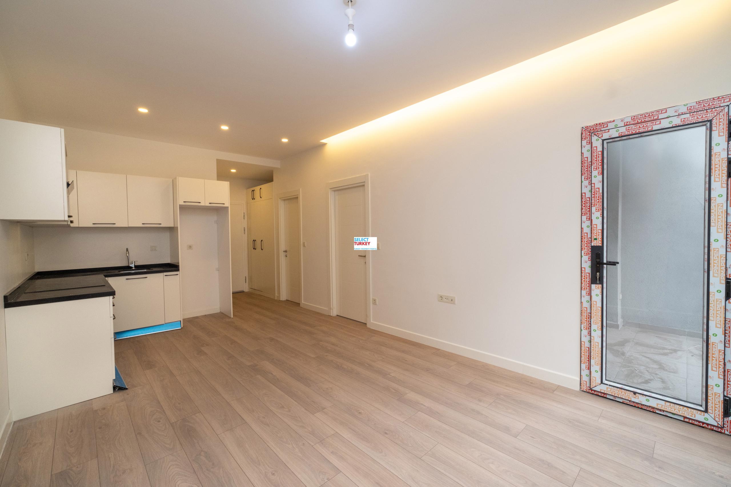 Spacious and bright living room in Taksim Palas, featuring contemporary furniture and large windows with city views